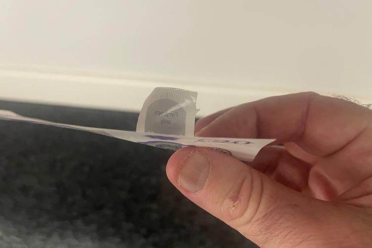 A raised sticker on this note shows it's counterfeit, as Wellington Banking Hub warn local community to be vigilant.