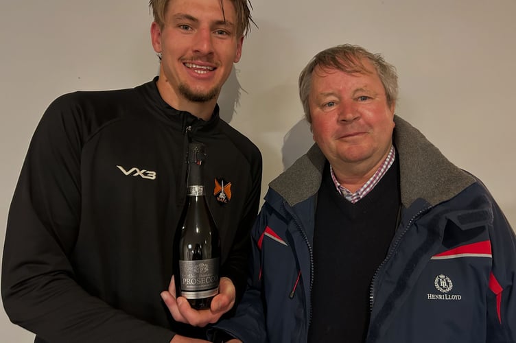 Defender Jordan Hayman was Welington's Player of the Match and he is pictured with Nick Tredwin, of sponsors H Tredwin & Son.