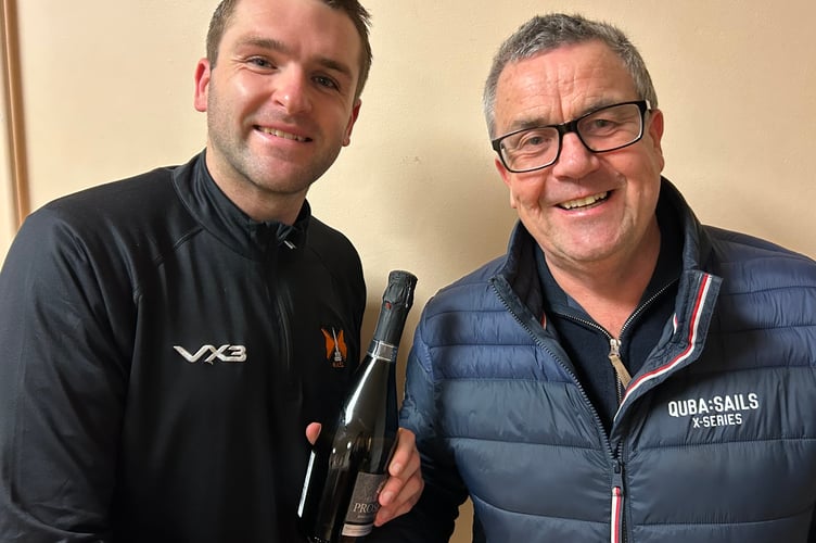 Defender Mark Cornish (left) was Wellington's player of the match  and he is pictured with the sponsor and former player Mike Rogers of AFH Wealth Management.