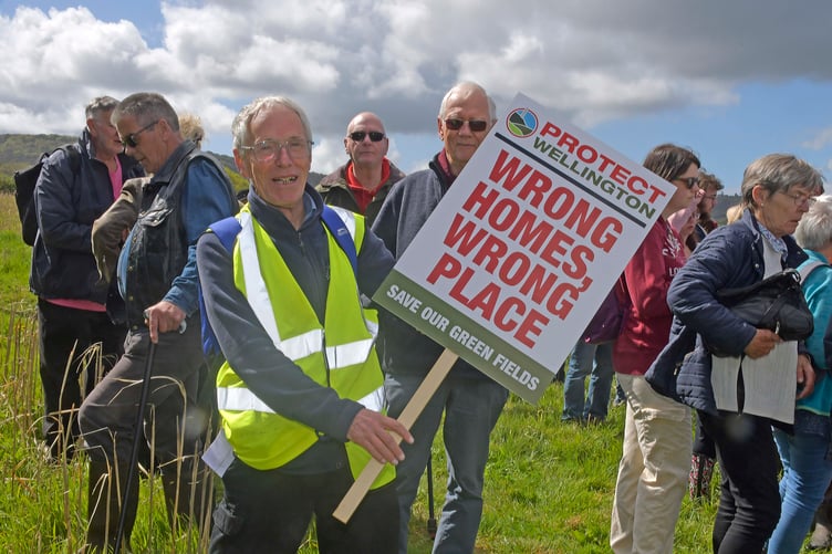 A placard that says a thousand words at a Protect Wellington rally against Pegasus housing plans. PHOTO: Alain Lockyer.