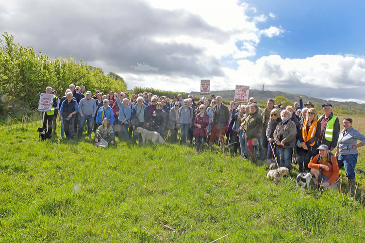 Wellington Monument can be seen on the Blackdown Hills behind Protect Wellington demonstrators.