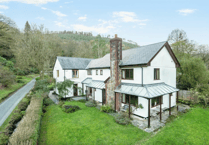 Idyllic property for sale with stream bordered gardens