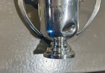 How did a replica of Baker Cup find its way into a garden?