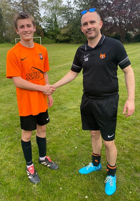 Player of the match Zac F with Town coach Scott Bates  