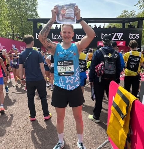 Harry kept his daughter Olivia close during the race with her picture tucked inside his socks.