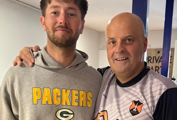 Player of the match Rohan Poulsom – playing in goal on his return from Canada – with Michael Owen.