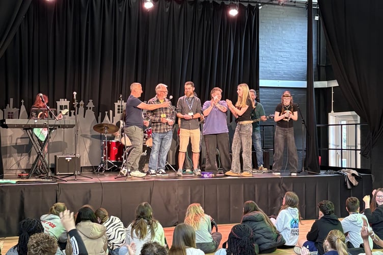 Teachers join student band Slowburne on stage for the final song of their fantastic performance. 