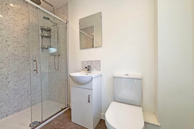 The master bedroom benefits from an en-suite shower room