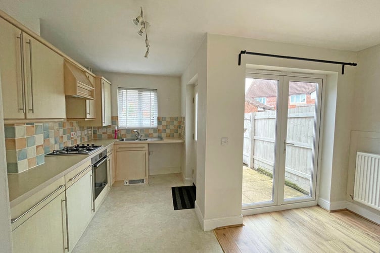 The kitchen/dining room has access out into the garden