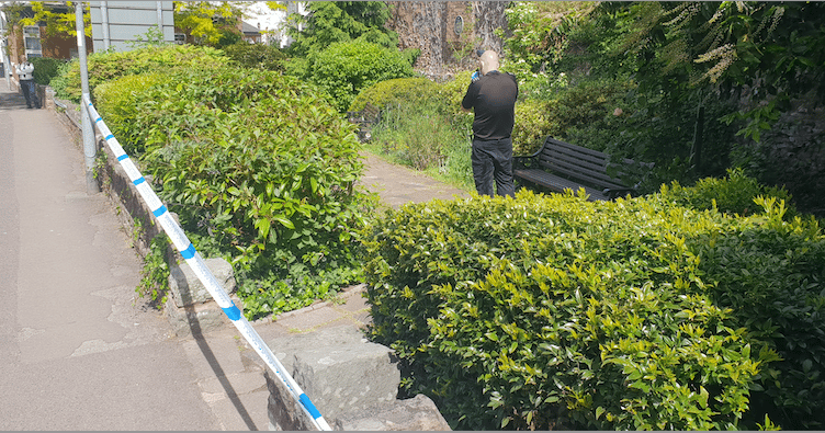 A police scenes of crime photographer at work in Monmouth Gardens, Wellington, on Friday morning.