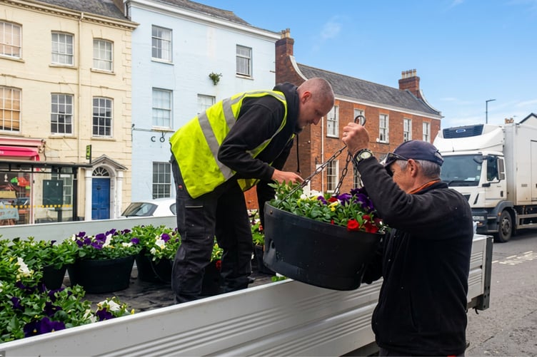 Wellington Town Council open spaces team hanging baskets ready for the bank holiday weekend.