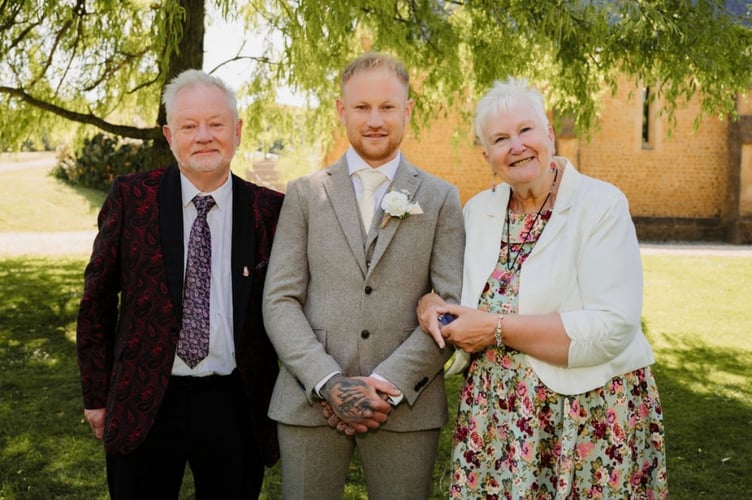 James Webber, here with his parents, is planning to run four marathons in a single day for Cancer Research UK. 