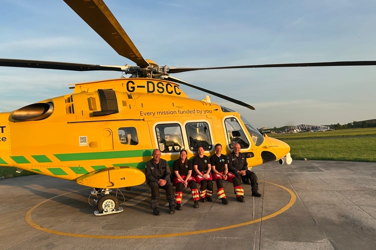 A Dorset and Somerset Air Ambulance crew with the charity's second helicopter.