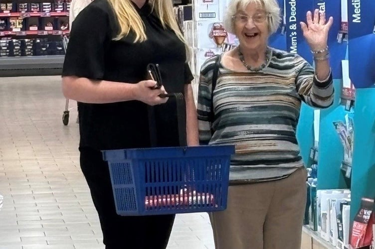 Camelot House home manager Zillah Oakes with resident Jean browsing the aisles. 