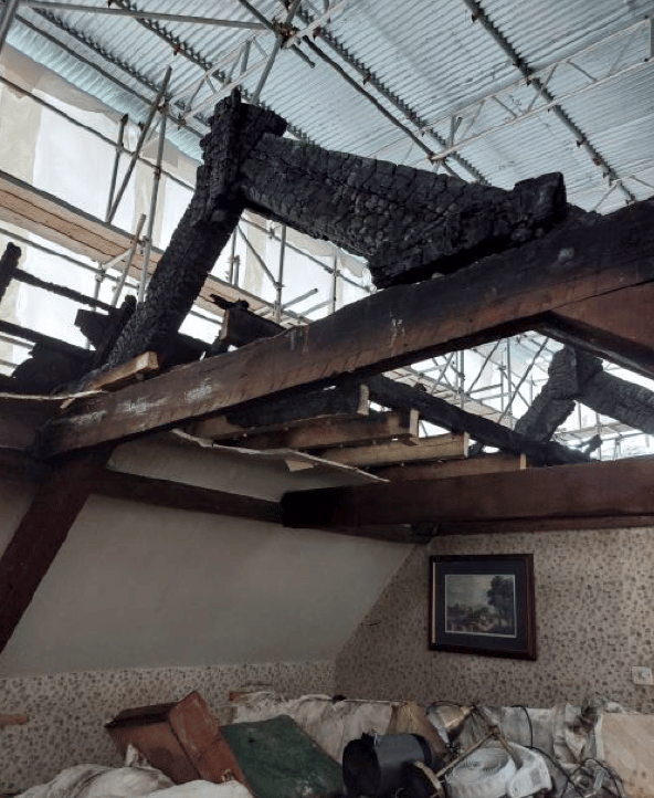 Fire damage can be seen in a bedroom of Bindon House, Langford Budville.