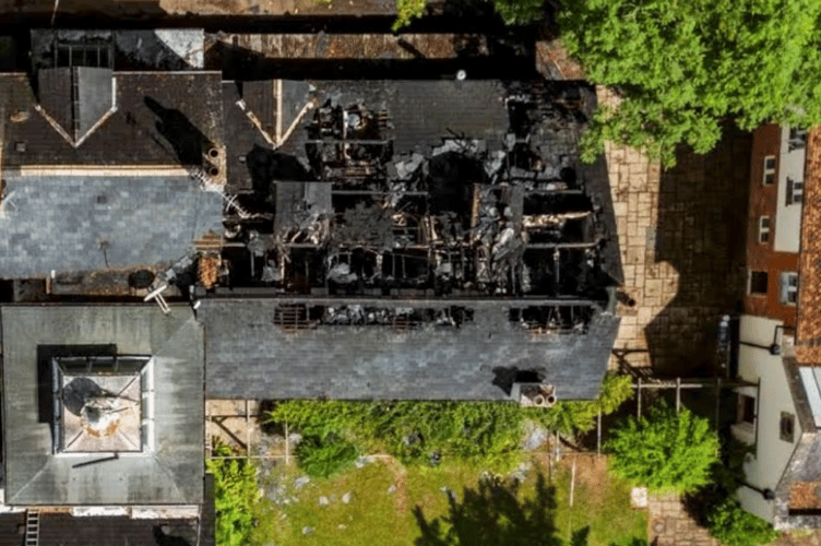 An aerial view of the fire-damaged roof of Bindon House, Langford Budville, before the north slope collapsed.