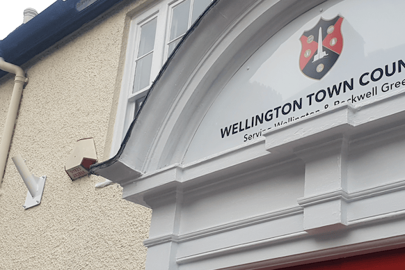 A flagpole bracket without a flag can be seen to the left of this photograph of Wellington Town Council's offices.