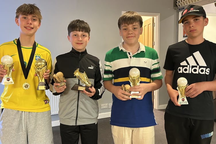 Trophy winners, from left, Zach, Blake, Fin and Caleb.