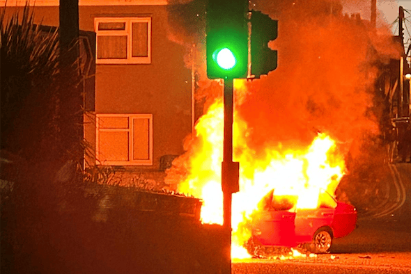 A classic car is engulfed in flames at the Rockwell Green crossroads on Saturday, June 13. PHOTO: Bianca Hamlyn.