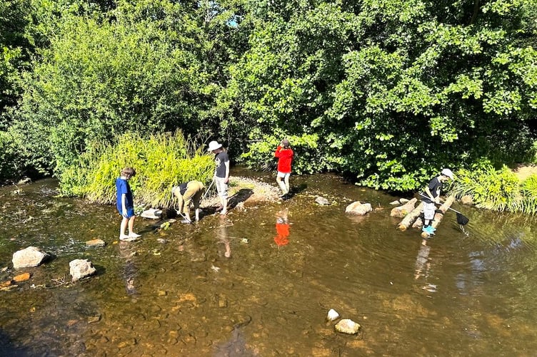 Younger members of the group were all too keen to get in and investigate the river.