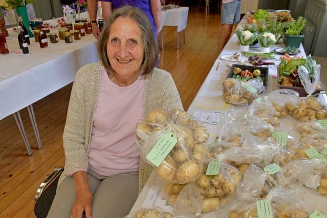 Gill Hatcher with her winning entry of heaviest potato crop grown in a bucket.