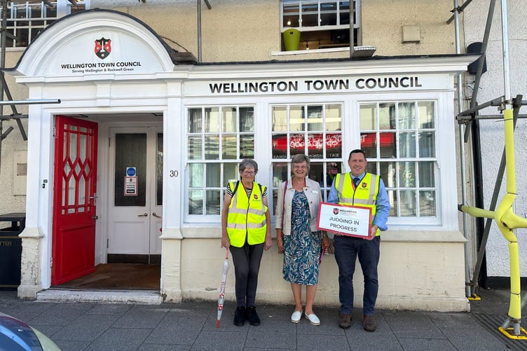 South West in Bloom judge Jane Pagano is met by former Wellington mayor Cllr Janet Lloyd and town council open spaces manager Darren Hill.