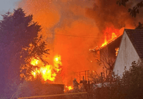 Community rallies round as two families lose everything in huge village fire