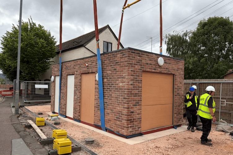 New toilets are craned into place in Longforth Road, Wellington.