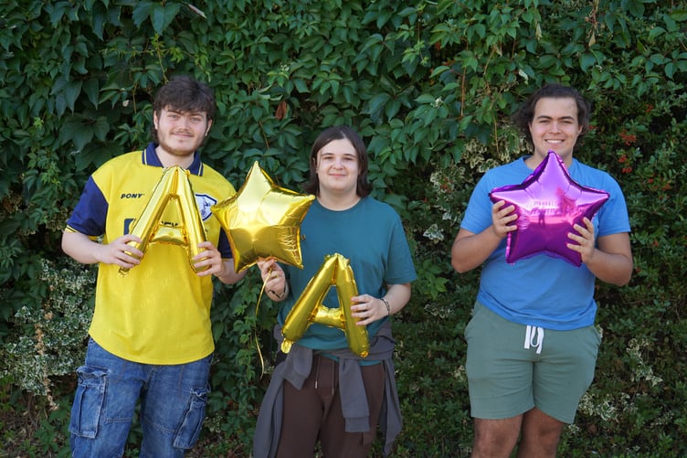 Wellington students Toby Buffham, Adam Montgomery and Kobe Duheaume celebrating their A level results.