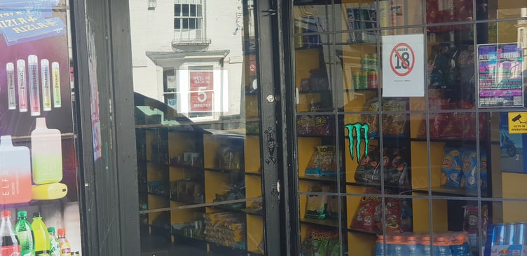 'Back in five minutes' says a sign on the front door of Wellington's Danya Store on Saturday.