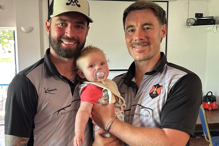 Player-of-the-match Ollie Nott (right) is pictured with his daughter Nelly and skipper Jack Bryant.