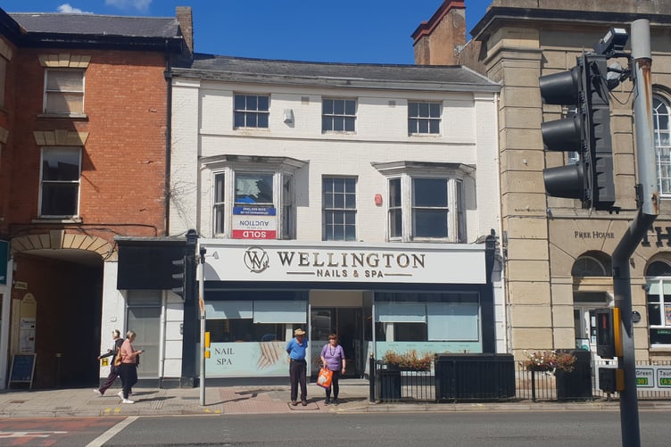 A planning application has been made seeking permission to create flats from office space on the upper floors of the white building pictured in Wellington town centre.