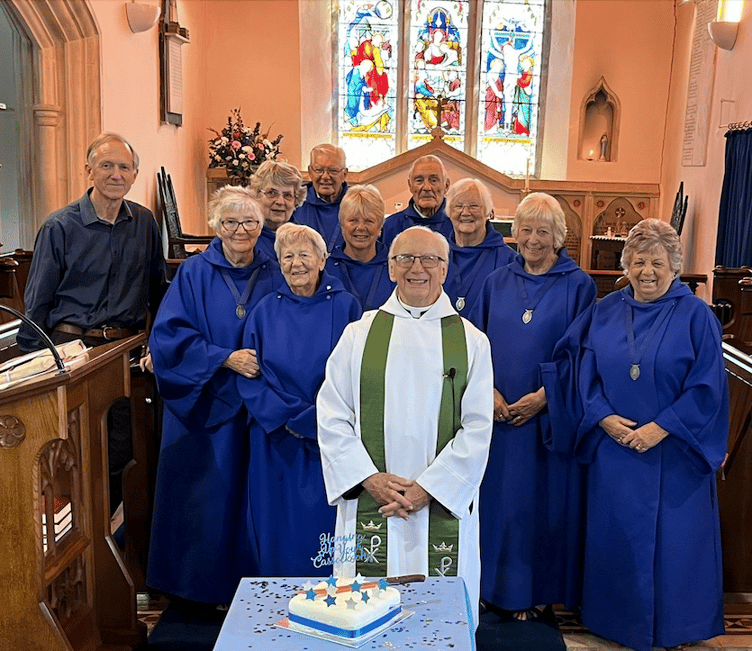 Retiring Hemyock minister the Rev John Stone with the church choir. PHOTO: David Bawler.