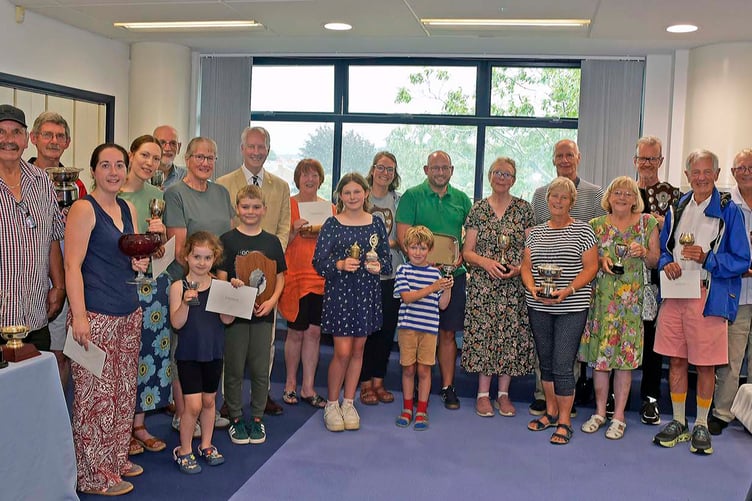 Assembled winners from the Wellington Flower Show with their trophies and prizes with MP Gideon Amos.