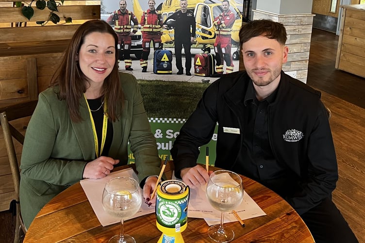 Rumwell Farm Shop’s Peppe Carullo preparing for the quiz with Charlotte Humber from the air ambulance.