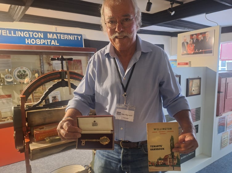 Wellington Museum chairman Mike Menhenitt with the mystery golden key a and 1950s council tenants' handbook.