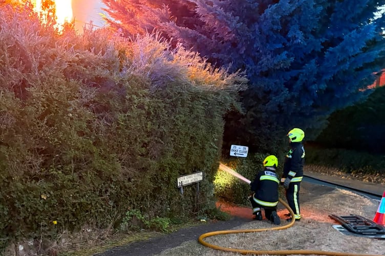 Wellington firefighters at the scene of a devastating fire this summer in Oake.