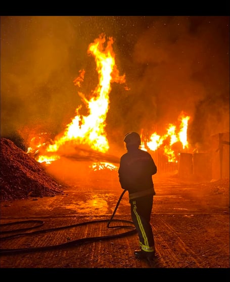 Wellington firefighters tackling a barn fire in July with multiple stations in attendance.
