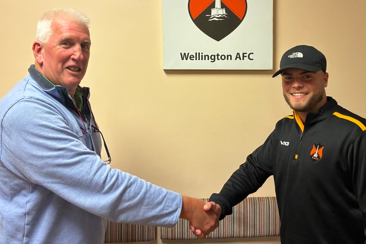 Elijah Hiller was Wellington's player of the match v Bridgwater United and he is pictured being congratulated by Andy Govier on behalf of sponsor Phil Conn.