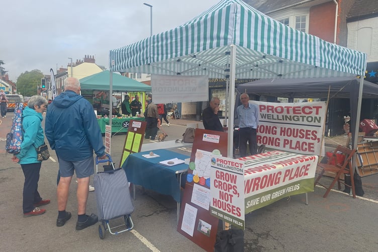 Members of the Protect Wellington community group on a street market stall heard people's concerns about inappropriate housing plans.