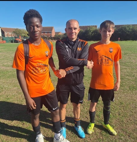 Players of the match Gbuyi O and Seb N with coach Scott Bates