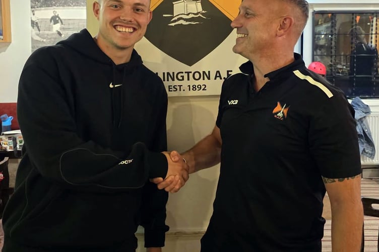 Wellington's Player of the Match Luke Vernon (left) is congratulated by coach John Norman.