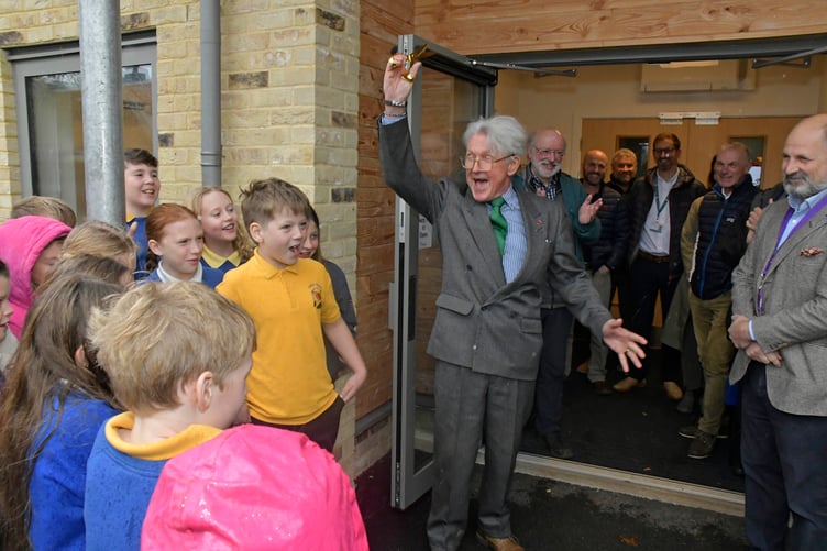 The official ribbon cutting for the opening of the new Stawley Primary School carried out by former governor John Hannon, with current chairman of governors Ben Burdon-Cooper (right). PHOTO: Alain Lockyer.
