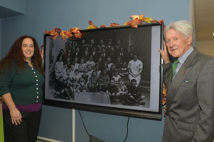 Stawley Primary School headteacher Jacqui Collier and former governor John Hannon, who is credited with saving it from closure, view an archive of school photographs. PHOTO: Alain Lockyer.