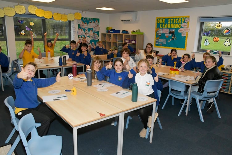 Pupils of Stawley Primary School give the thumbs up to their newly-built classrooms. PHOTO: Alain Lockyer.