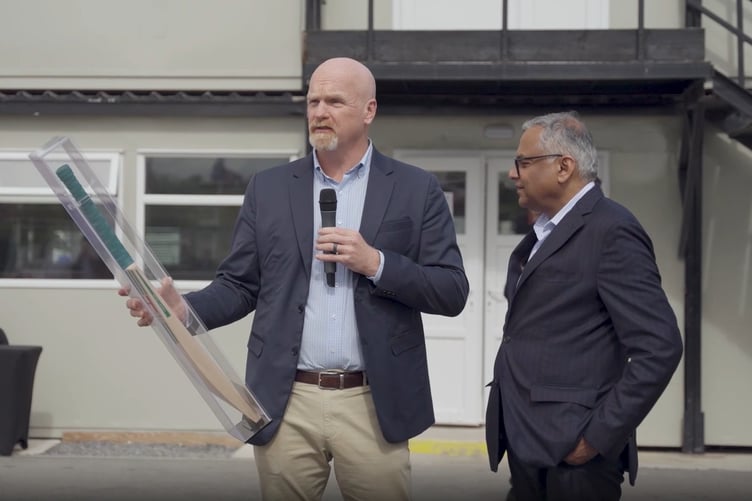 Agratas Chief Executive Officer Tom Flack (left) presents a Millichamp and Hall cricket bat to Mr N. Chandrasekaran, the chairman of India’s Tata Group.